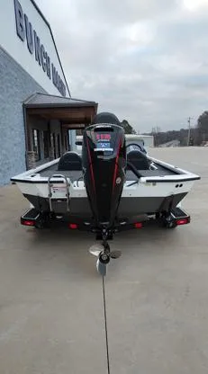 Slide: The Image of 2025 Vexus AVX1880 boat, rear view, parked outside dealership. - 11