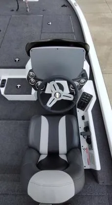 Slide: The Image of 2025 Vexus AVX1880 boat interior with steering wheel and seating. - 7