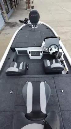 Slide: The Image of 2025 Vexus AVX1880 boat interior with modern seating and steering console. - 8