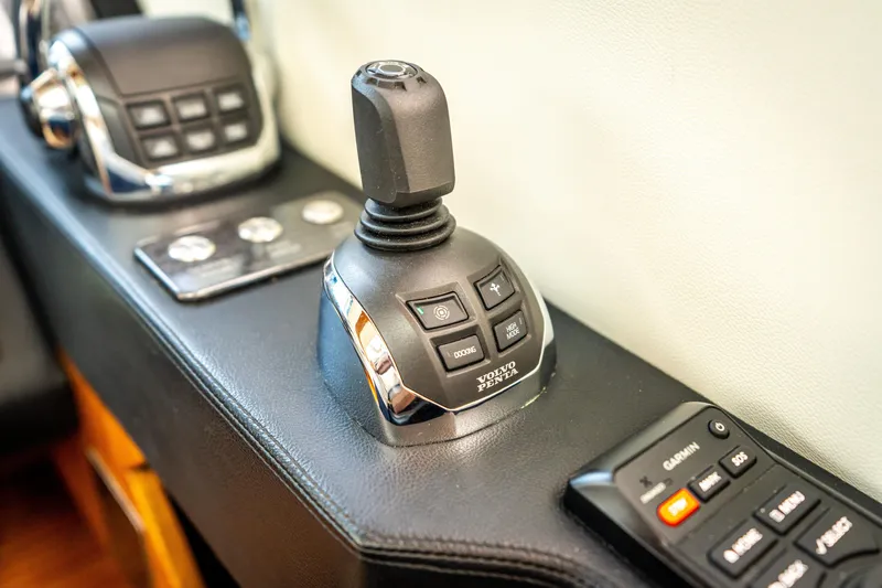 Slide: The Image of Joystick control panel on 2017 Riviera 6000 Sport Yacht, featuring modern navigation technology. - 23
