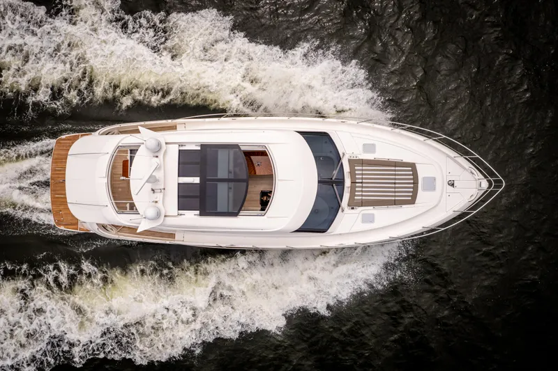 Slide: The Image of Aerial view of 2017 Riviera 6000 Sport Yacht cruising on water. - 3