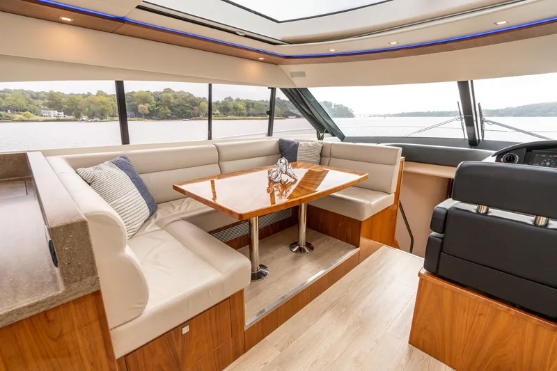 Slide: The Image of Luxurious interior of 2017 Riviera 6000 Sport Yacht with elegant seating and scenic views. - 30