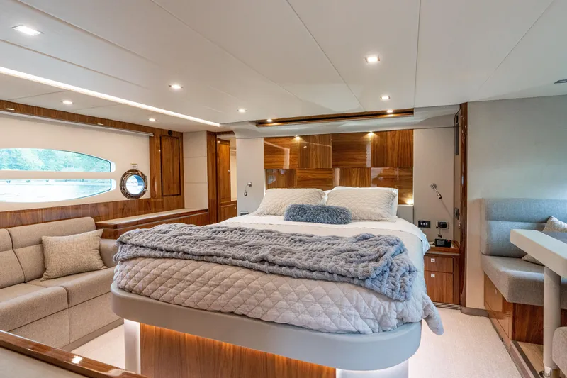 Slide: The Image of Luxurious interior of 2017 Riviera 6000 Sport Yacht with elegant bedroom and seating area. - 36