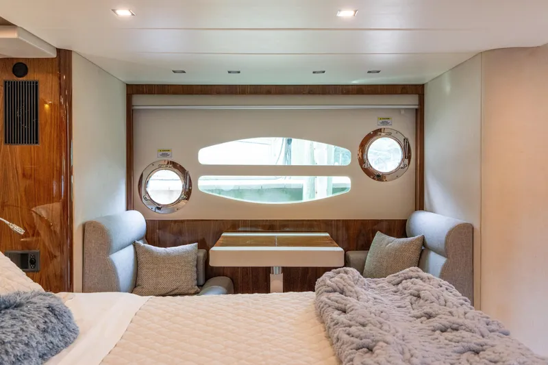 Slide: The Image of Luxurious interior of 2017 Riviera 6000 Sport Yacht with cozy seating and elegant decor. - 39