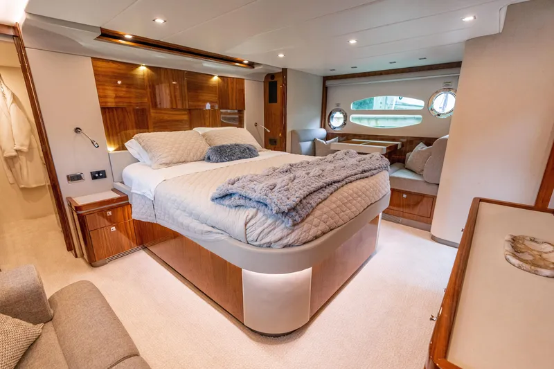 Slide: The Image of Luxurious bedroom interior of 2017 Riviera 6000 Sport Yacht with elegant wood finishes. - 41