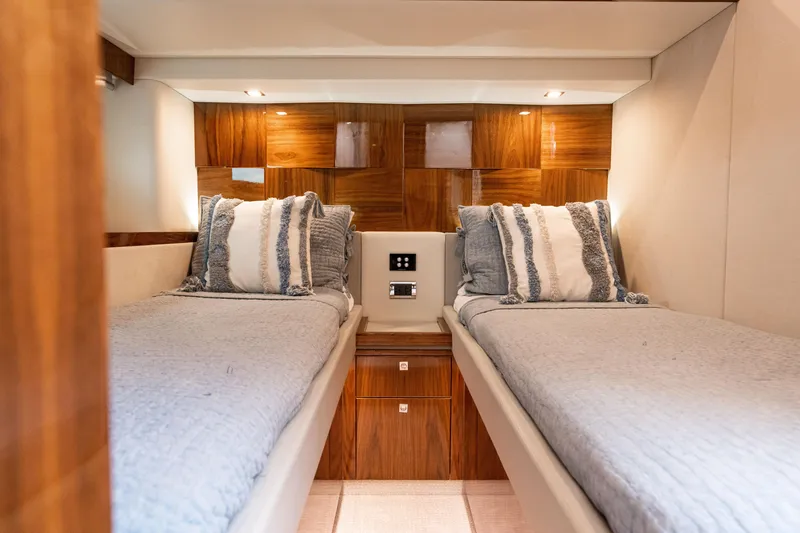 Slide: The Image of Luxurious twin cabin in 2017 Riviera 6000 Sport Yacht with elegant wood paneling. - 47