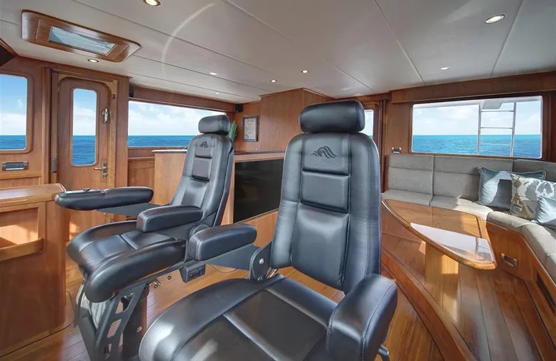 Slide: The Image of Luxurious interior of 2020 Outer Reef Yachts 720 Deluxbridge Motoryacht with leather seating and ocean view. - 10