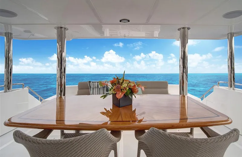 Slide: The Image of Luxurious 2020 Outer Reef Yachts 720 Deluxbridge Motoryacht with elegant dining area and ocean view. - 2