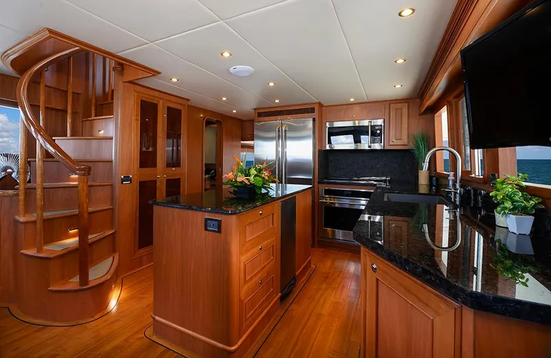 Slide: The Image of Luxurious kitchen interior of 2020 Outer Reef Yachts 720 Deluxbridge Motoryacht with wood finishes. - 7