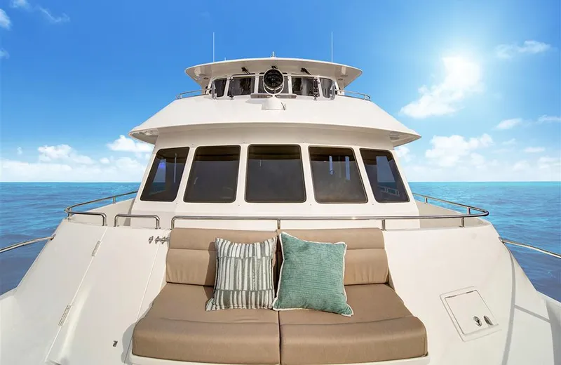 Slide: The Image of 2020 Outer Reef Yachts 720 Deluxbridge Motoryacht on open sea, featuring spacious deck seating. - 1