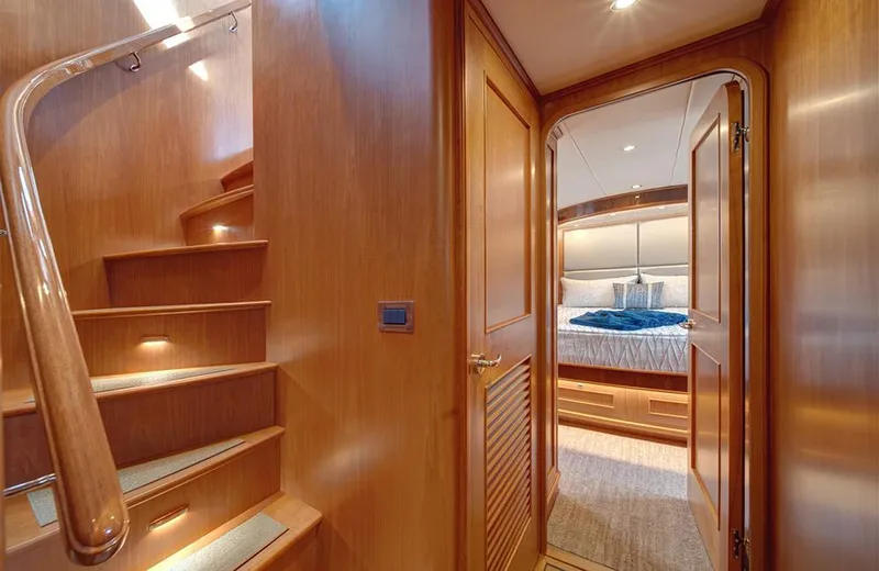 Slide: The Image of Luxurious interior of 2020 Outer Reef Yachts 720 Deluxbridge Motoryacht with wooden staircase and bedroom. - 15