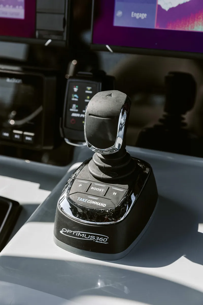 Slide: The Image of Joystick control on 2025 Sea Pro 292 DLX boat dashboard. - 13