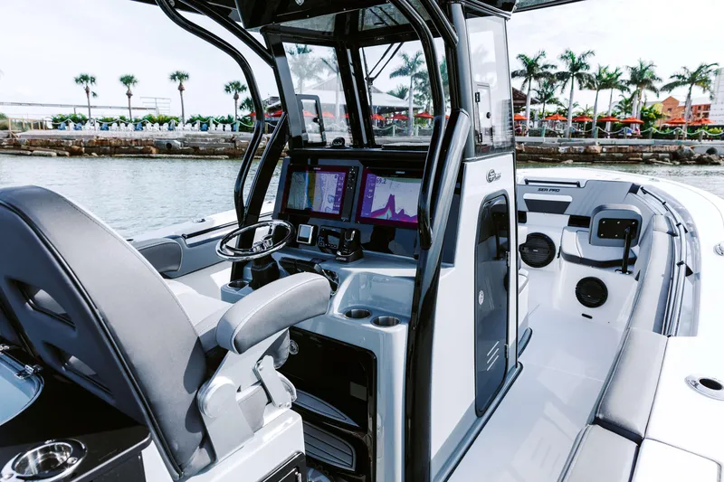Slide: The Image of 2025 Sea Pro 292 DLX boat interior with advanced navigation system and sleek design. - 2