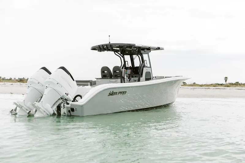 Slide: The Image of 2025 Sea Pro 292 DLX boat with dual engines on calm water. - 3