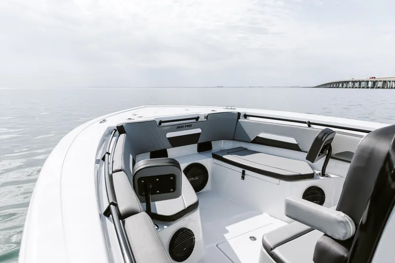 Slide: The Image of 2025 Sea Pro 292 DLX boat interior with sleek seating and ocean view. - 4