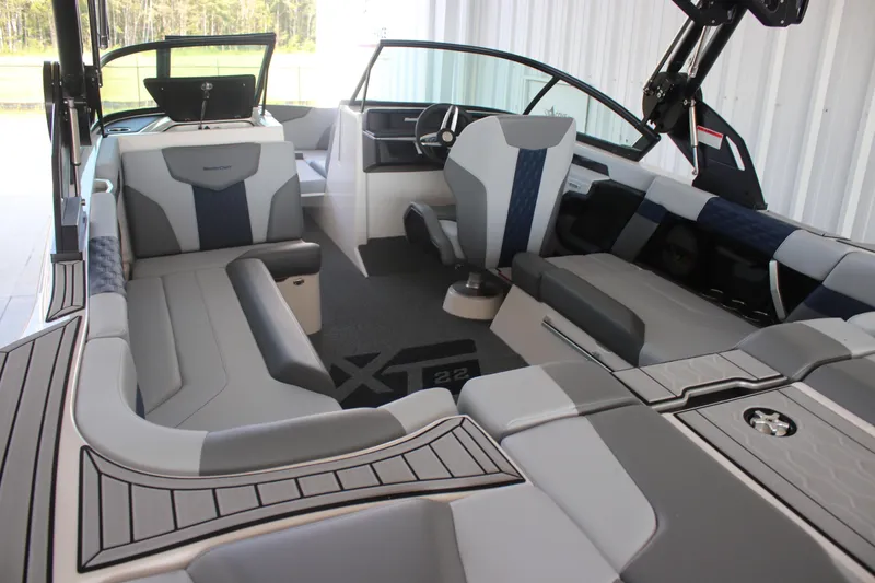 Slide: The Image of 2025 MasterCraft XT22 boat interior with luxurious seating and modern design. - 3