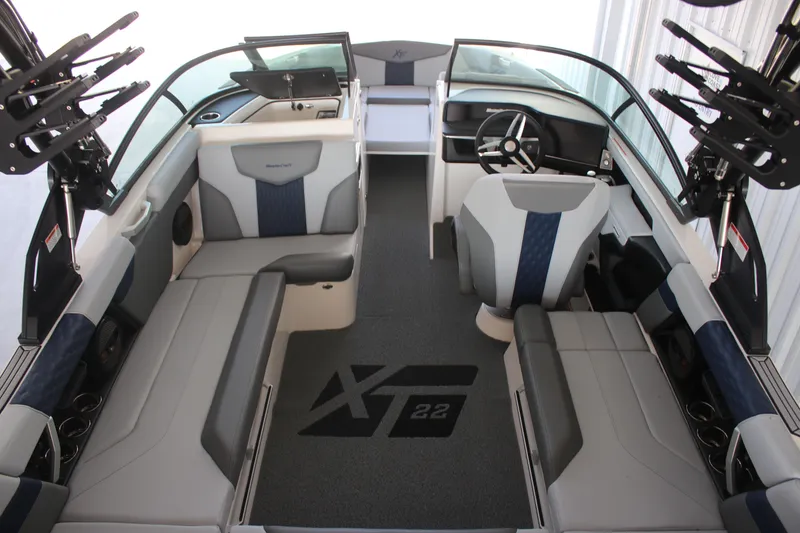 Slide: The Image of 2025 MasterCraft XT22 boat interior with modern seating and steering wheel. - 5
