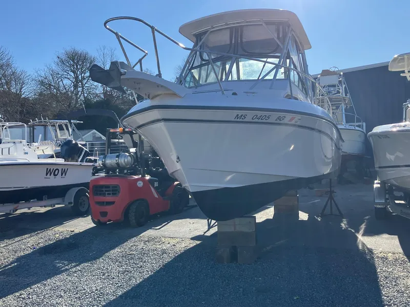 Slide: The Image of 2004 Grady-White 232 Gulfstream boat on blocks, outdoor storage. - 1