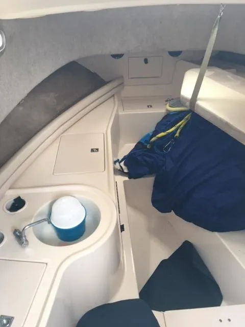 Slide: The Image of 2004 Grady-White 232 Gulfstream cabin interior with sink and storage. - 10