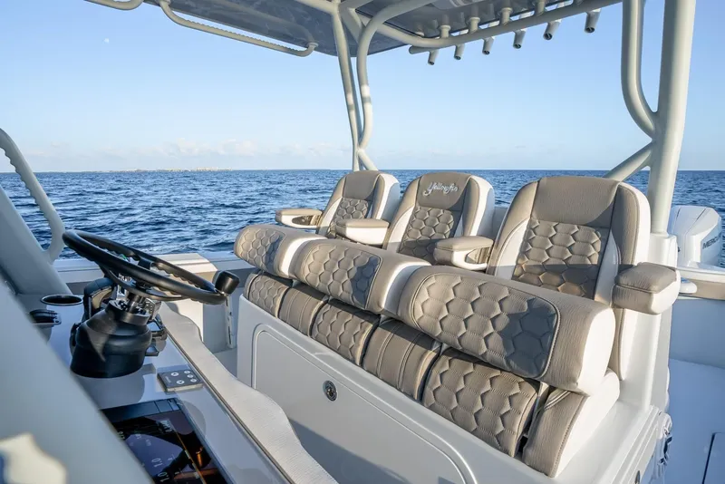 Slide: The Image of 2024 Yellowfin 39 boat interior with luxurious seating and ocean view. - 14