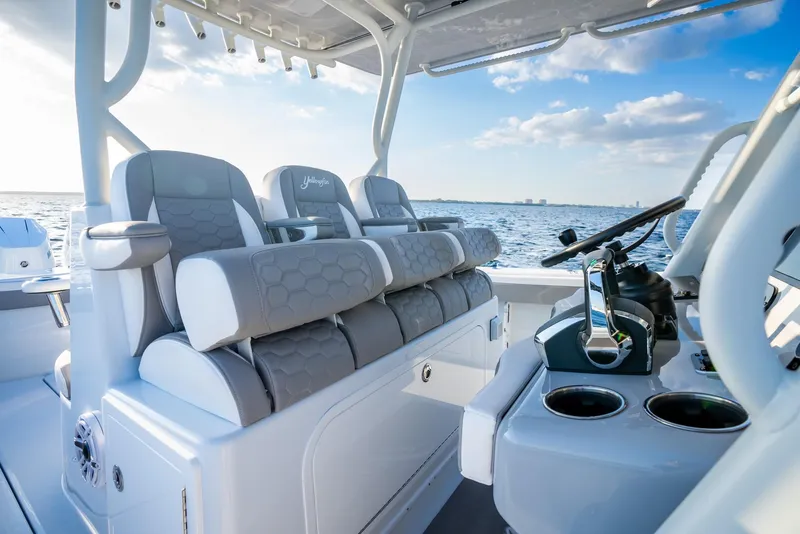 Slide: The Image of 2024 Yellowfin 39 boat interior with luxurious seating and ocean view. - 15