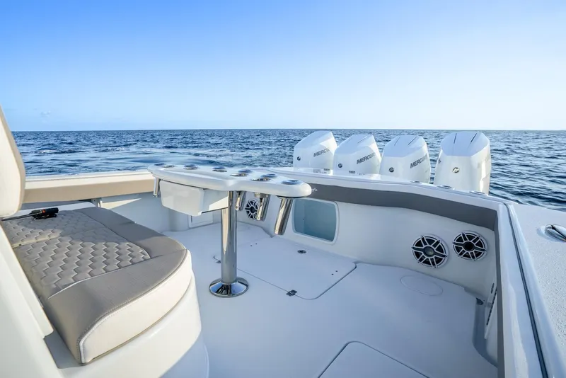 Slide: The Image of 2024 Yellowfin 39 boat interior with ocean view and multiple outboard engines. - 19