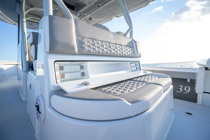 Slide: The Image of 2024 Yellowfin 39 boat interior with cushioned seating and modern design. - 22