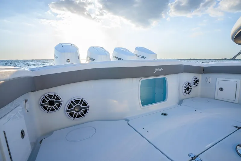 Slide: The Image of 2024 Yellowfin 39 boat deck with speakers and Mercury engines at sea. - 23
