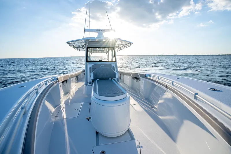 Slide: The Image of 2024 Yellowfin 39 boat on open water, sunlit deck and clear sky. - 25
