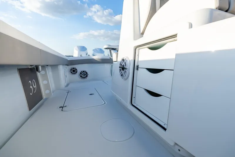 Slide: The Image of 2024 Yellowfin 39 boat interior with storage drawers and speakers. - 30