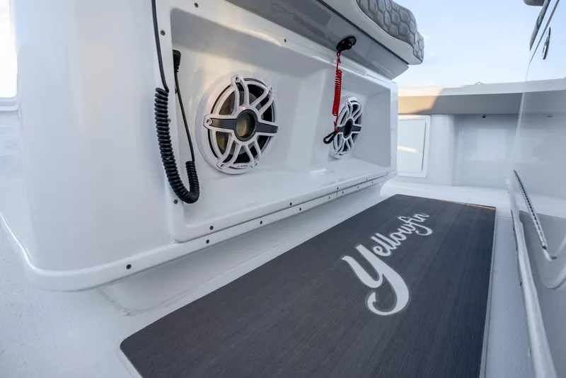 Slide: The Image of 2024 Yellowfin 39 boat interior with speakers and branded mat. - 32