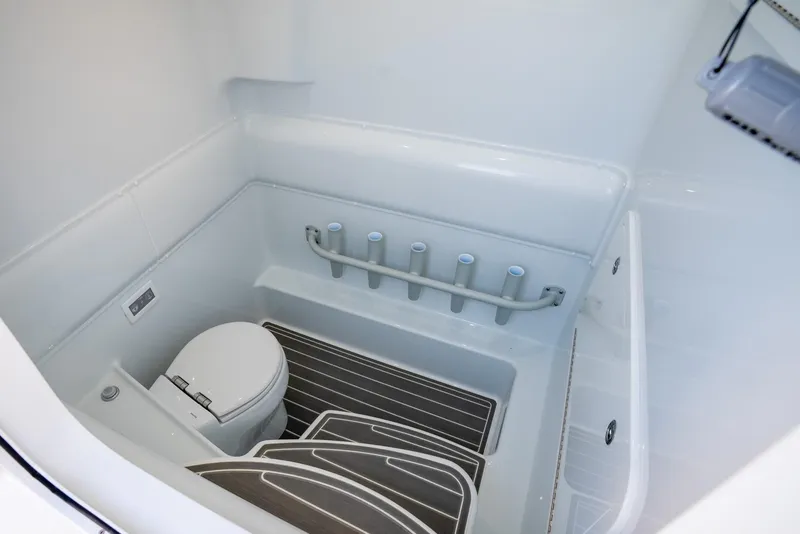 Slide: The Image of 2024 Yellowfin 39 boat interior bathroom with toilet and storage features. - 34
