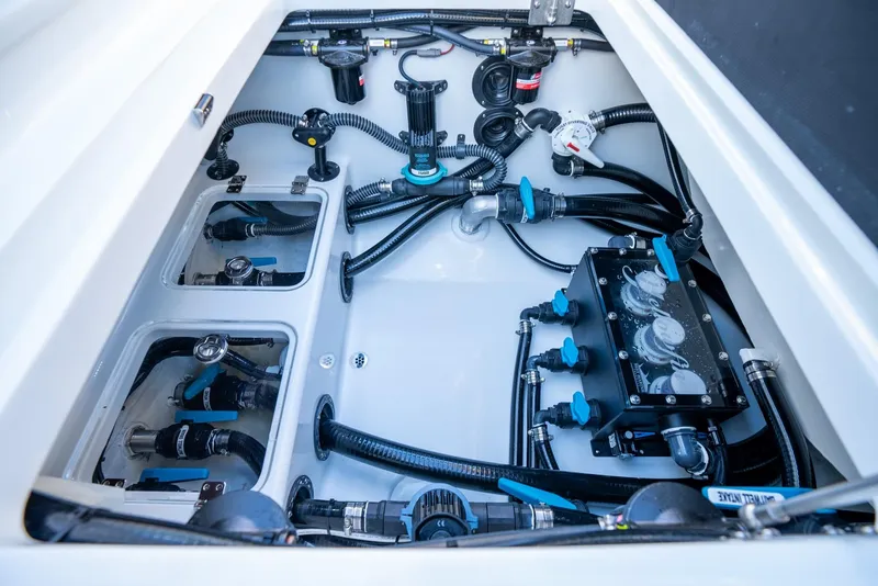Slide: The Image of 2024 Yellowfin 39 boat engine compartment with advanced wiring and plumbing systems. - 37