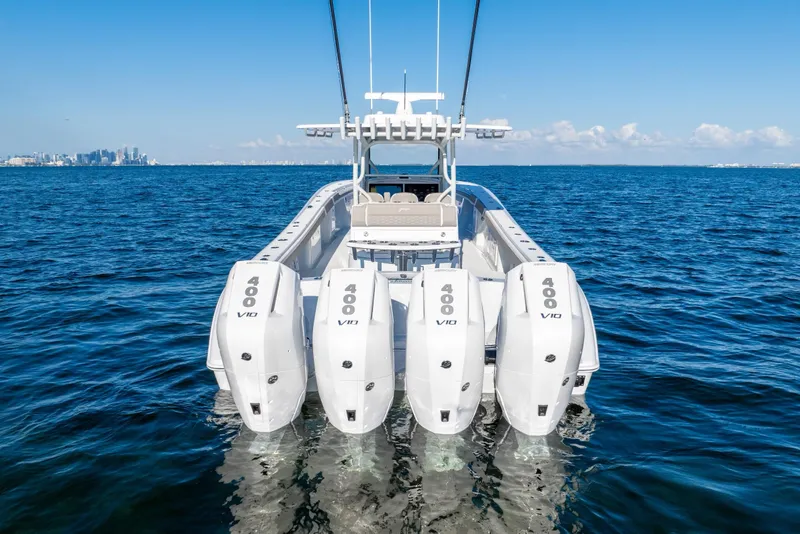 Slide: The Image of 2024 Yellowfin 39 boat with four powerful outboard engines on open water. - 8