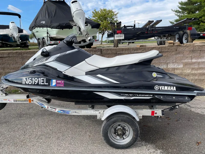 Slide: The Image of 2017 Yamaha WaveRunner EX Sport on trailer, black and white design, parked outdoors. - 3