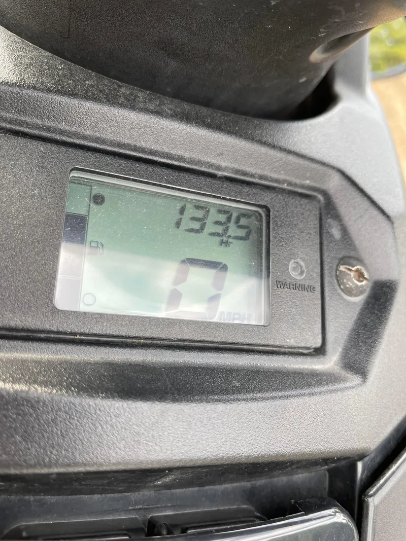 Slide: The Image of Close-up of 2017 Yamaha WaveRunner EX Sport digital display showing 133.9 hours. - 6