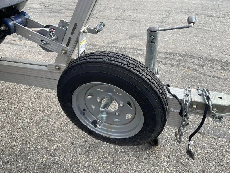 Slide: The Image of Trailer wheel for 2017 Yamaha WaveRunner EX Sport on asphalt. - 7