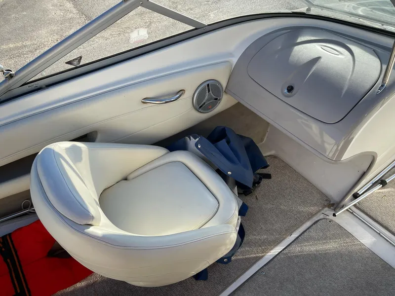 Slide: The Image of 2007 Maxum 1900 SR-3 boat interior with white seating and dashboard. - 11