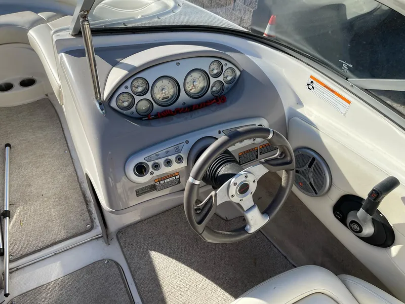 Slide: The Image of 2007 Maxum 1900 SR-3 boat dashboard with steering wheel and instrument panel. - 13