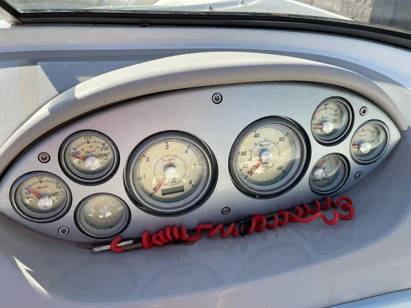 Slide: The Image of Dashboard of 2007 Maxum 1900 SR-3 boat with gauges and red safety cord. - 14