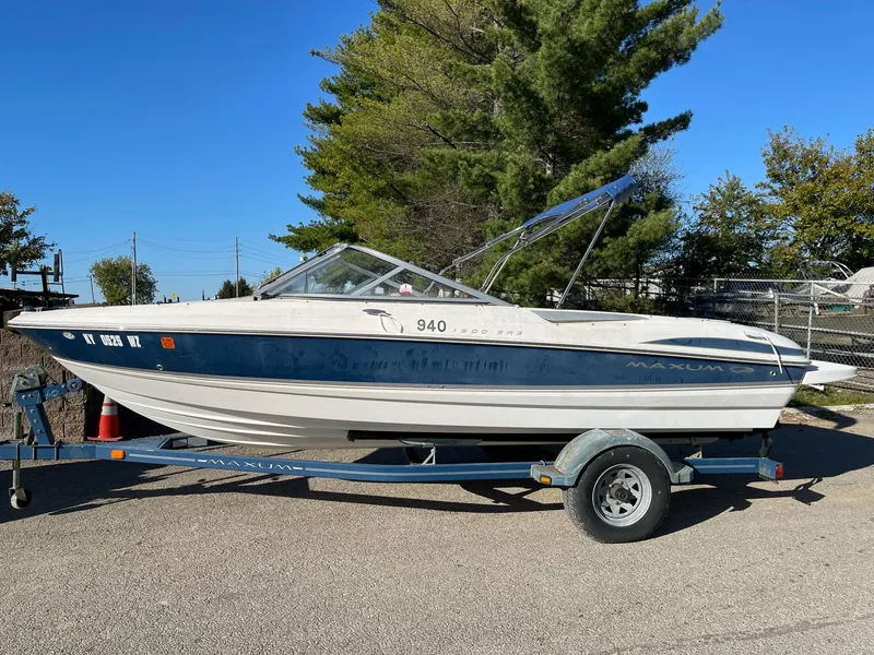 Slide: The Image of 2007 Maxum 1900 SR-3 boat on trailer, parked outdoors. - 2