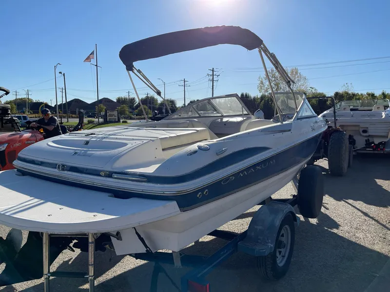 Slide: The Image of 2007 Maxum 1900 SR-3 boat on trailer, sunny day, American flag in background. - 5
