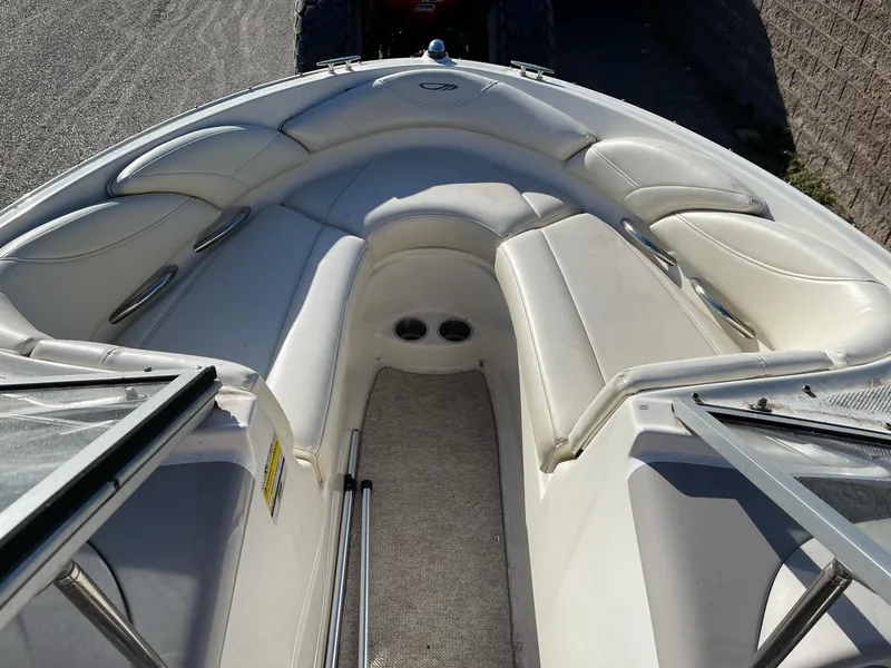 Slide: The Image of 2007 Maxum 1900 SR-3 boat interior with white cushioned seating. - 7