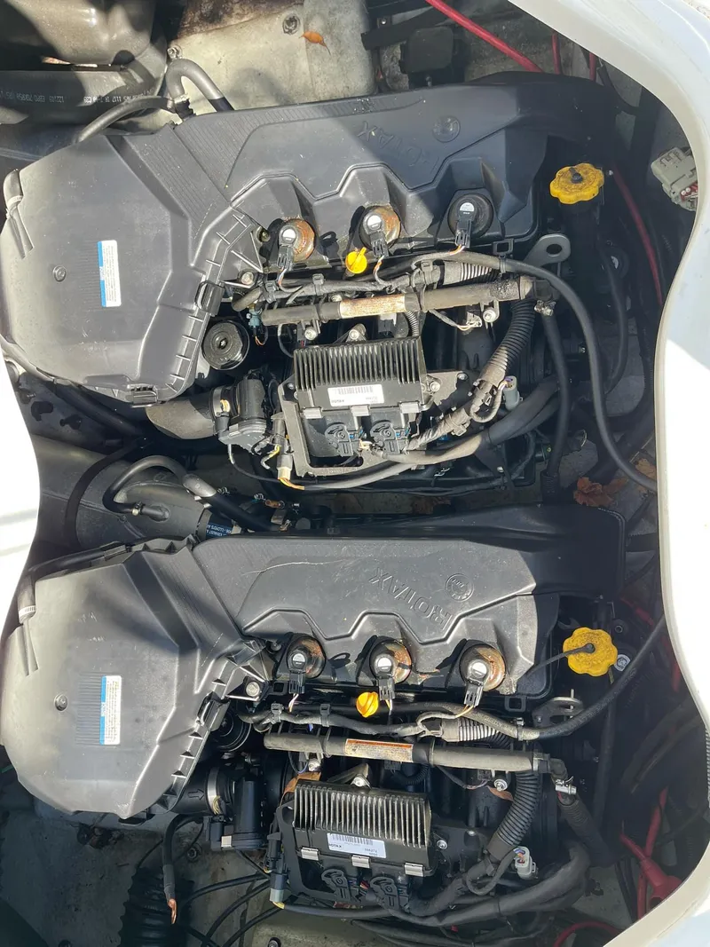 Slide: The Image of 2010 Sea-Doo 210 Challenger engine compartment with dual engines. - 17
