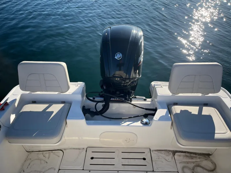 Slide: The Image of 2020 Boston Whaler 170 Montauk boat with outboard motor on calm water. - 12