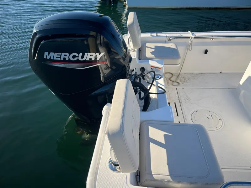 Slide: The Image of 2020 Boston Whaler 170 Montauk with Mercury outboard engine on calm water. - 14