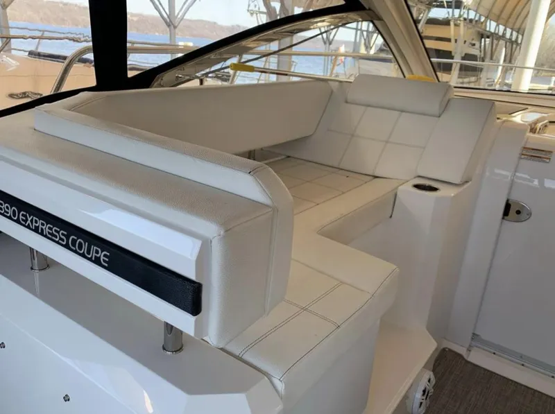 Slide: The Image of 2018 Cruisers 390 Express Coupe interior seating with white upholstery. - 9