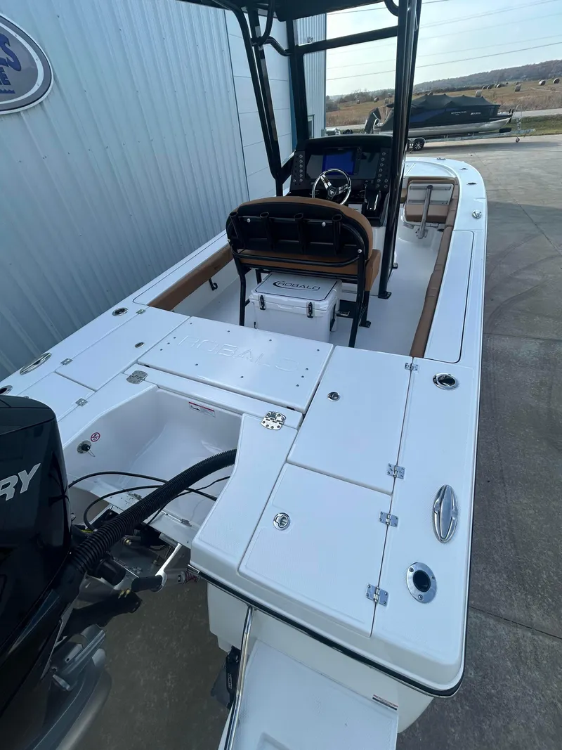 Slide: The Image of 2025 Robalo 246 Cayman boat, white deck, black console, outdoor setting. - 3