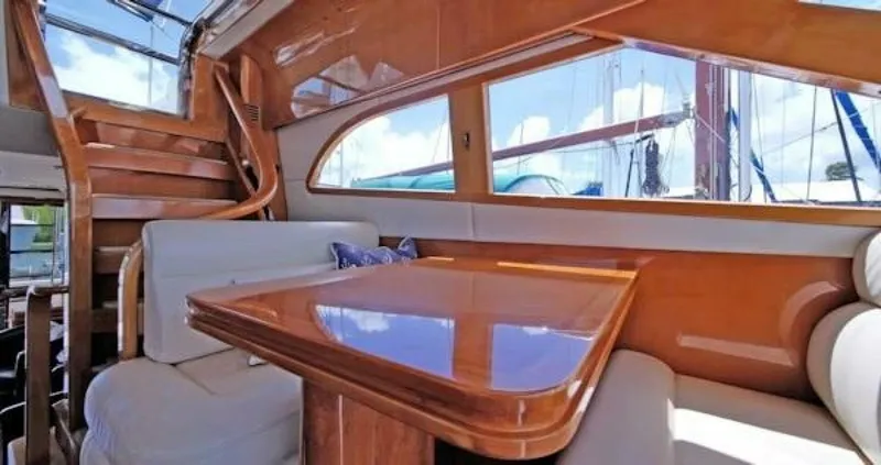 Slide: The Image of Luxurious 2004 McKinna Pilothouse interior with polished wood and comfortable seating. - 14