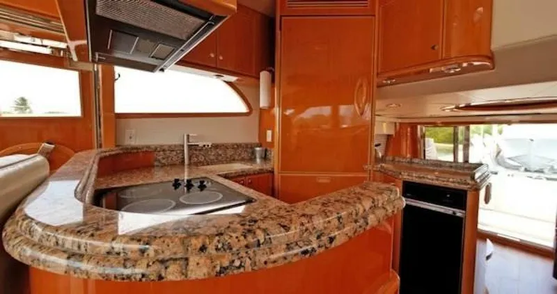 Slide: The Image of Luxurious 2004 McKinna Pilothouse yacht kitchen with granite countertops and modern appliances. - 21